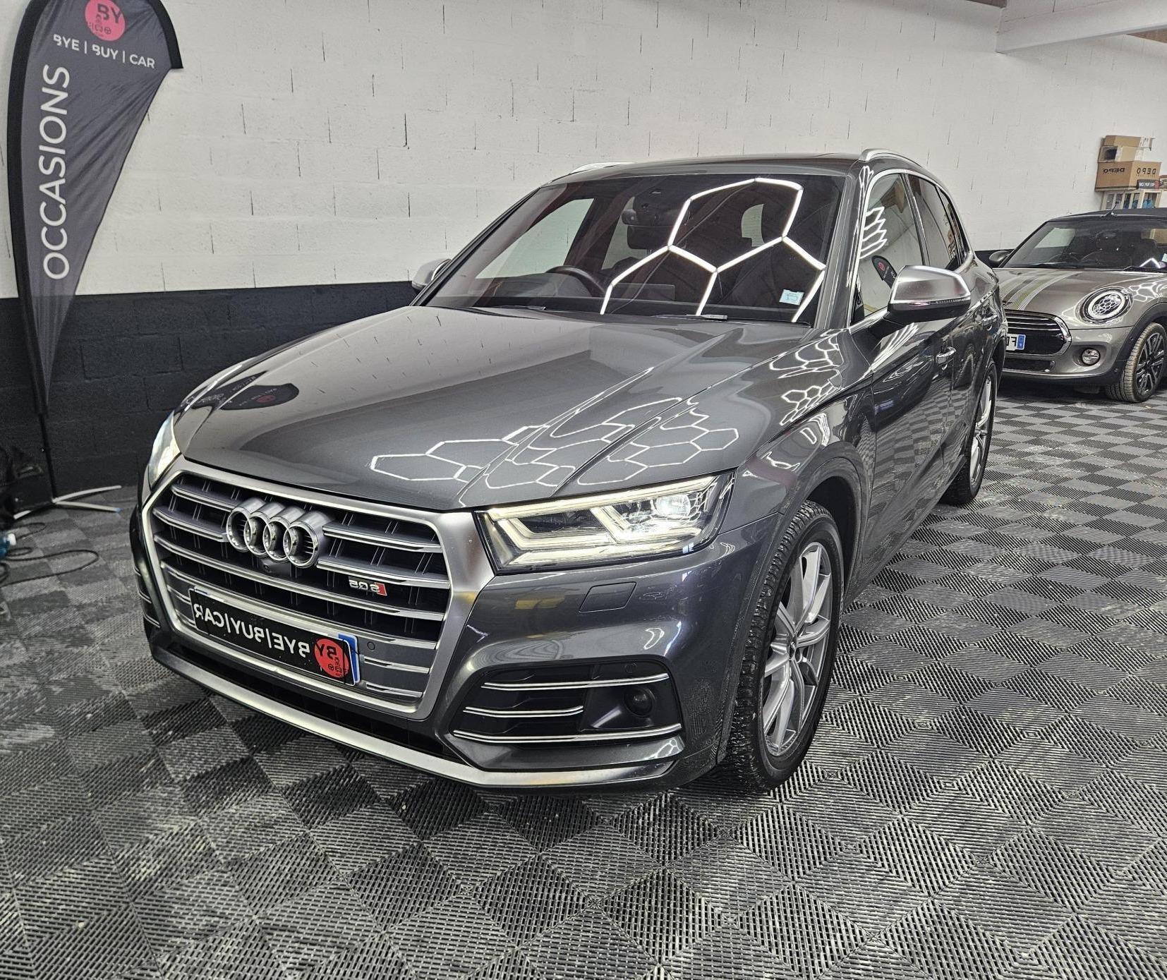 Découvrez ce superbe AUDI SQ5 Quattro 3.0 V6 TDI de 347 ch, un SUV premium alliant sportivité, élégance et polyvalence. Son puissant moteur V6 TDI délivre des performances impressionnantes tout en conservant un excellent agrément de conduite. Associé à la boîte automatique Tiptronic S, il offre des passages de rapports fluides et réactifs. La transmission intégrale Quattro garantit une motricité et une tenue de route exceptionnelles en toutes circonstances. À bord, vous profiterez d’un intérieur haut de gamme, spacieux et confortable, parfaitement adapté aux longs trajets. Le SQ5 offre également un excellent compromis entre performances, confort familial et praticité au quotidien. Ses 347 ch et son couple généreux procurent des sensations de conduite dignes d’une véritable sportive. Véhicule proposé avec une GARANTIE 12 MOIS pour vous offrir encore plus de sérénité.